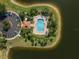 Aerial view of a resort-style pool, surrounded by well-manicured landscaping, ample seating and lounge area for residents at 3671 Parkridge Cir # 8-201, Sarasota, FL 34243