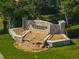 Stone Parkridge community sign with waterfall feature is surrounded by manicured landscaping at 3671 Parkridge Cir # 8-201, Sarasota, FL 34243