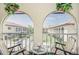Inviting balcony featuring serene views of the community's landscaped grounds and charming architecture at 3690 Pinecrest St # 124, Sarasota, FL 34232