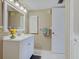 Cozy bathroom featuring a white vanity and cabinet for ample storage space at 3690 Pinecrest St # 124, Sarasota, FL 34232