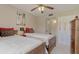 Comfortable bedroom featuring twin beds, neutral walls, and ceiling fan at 3690 Pinecrest St # 124, Sarasota, FL 34232