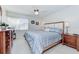 Primary bedroom featuring carpeted floor, ceiling fan and bright windows at 3690 Pinecrest St # 124, Sarasota, FL 34232