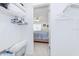 Walk-in closet view into the primary bedroom featuring carpeted floor and bright windows at 3690 Pinecrest St # 124, Sarasota, FL 34232
