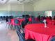Community center with tables and chairs for events, offering a gathering space for residents at 3690 Pinecrest St # 124, Sarasota, FL 34232