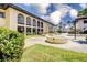 Exterior view of the community with lush landscaping and a shared courtyard at 3690 Pinecrest St # 124, Sarasota, FL 34232