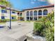 Beautiful courtyard of building exterior featuring well-kept landscaping at 3690 Pinecrest St # 124, Sarasota, FL 34232