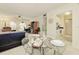 Dining area featuring a glass table with an ornate metal base and seating for two at 3690 Pinecrest St # 124, Sarasota, FL 34232