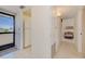 Inviting entryway flows into kitchen, featuring bright neutral walls and tile flooring at 3690 Pinecrest St # 124, Sarasota, FL 34232