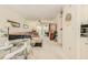 Open floor plan living room with dining area with garden view and carpeted floors at 3690 Pinecrest St # 124, Sarasota, FL 34232