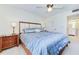 Spacious main bedroom with light, natural color palette and access to ensuite bath at 3690 Pinecrest St # 124, Sarasota, FL 34232