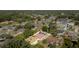 Aerial view of a serene property with a private pool, nestled among trees and landscaping in a residential community at 3736 Fontainebleau St, North Port, FL 34287