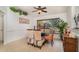 Bright dining room showcasing a modern glass table and stylish decor at 3736 Fontainebleau St, North Port, FL 34287