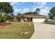 Charming single-story home featuring a well-manicured lawn and an attached two-car garage at 3736 Fontainebleau St, North Port, FL 34287