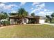 Well-maintained front yard with lush landscaping complements this charming single-story home at 3736 Fontainebleau St, North Port, FL 34287