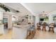 Bright kitchen with granite countertops, white cabinets, and bar seating at 3736 Fontainebleau St, North Port, FL 34287
