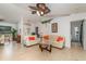 Bright living room featuring tile flooring, comfortable seating, and vaulted ceilings at 3736 Fontainebleau St, North Port, FL 34287