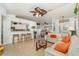 Open-concept living area boasts tile floors, a kitchen bar, and views into the dining area at 3736 Fontainebleau St, North Port, FL 34287