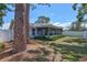 Backyard with mature trees and privacy fence at 3978 Lemonwood Dr, Sarasota, FL 34232
