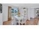 Charming dining area with white wood furnishings, neutral color walls, and natural light from the window at 3978 Lemonwood Dr, Sarasota, FL 34232