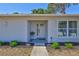 Bright entrance features a decorative front door and manicured landscaping at 3978 Lemonwood Dr, Sarasota, FL 34232