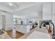 Bright kitchen offering Saltillo tile, granite countertops, and open design, providing a clear view of the living spaces at 3978 Lemonwood Dr, Sarasota, FL 34232