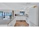 Bright kitchen with granite countertops, white cabinetry, and stainless-steel appliances at 3978 Lemonwood Dr, Sarasota, FL 34232