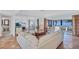 Spacious living room with open floor plan, Saltillo tile, decorative furnishings, and adjoining patio at 3978 Lemonwood Dr, Sarasota, FL 34232