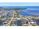 Aerial view of waterfront homes with boat docks lining canals, showcasing coastal living and water access at 4405 Harbor Blvd, Port Charlotte, FL 33952