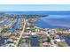 Stunning aerial view of coastal community and waterfront properties along the expansive bay at 4405 Harbor Blvd, Port Charlotte, FL 33952