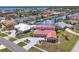 Beautiful home with a red tile roof, well-maintained landscaping, and a winding driveway at 4405 Harbor Blvd, Port Charlotte, FL 33952
