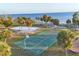 Overhead shot of community basketball and sand volleyball courts, adjacent to waterfront at 4405 Harbor Blvd, Port Charlotte, FL 33952