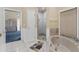 Bright bathroom with a soaking tub and walk-in shower accessible from the main bedroom at 4405 Harbor Blvd, Port Charlotte, FL 33952