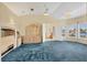 Spacious bedroom with vaulted ceilings, plush carpeting, and large windows offering natural light at 4405 Harbor Blvd, Port Charlotte, FL 33952