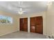 Bedroom with tile floors, a ceiling fan, and lots of closet space making storage a breeze at 4405 Harbor Blvd, Port Charlotte, FL 33952