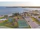 Aerial view of community recreational area with beach, pier, courts, and parking at 4405 Harbor Blvd, Port Charlotte, FL 33952