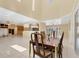 Open-concept floorplan showcasing a dining room leading to the kitchen and living areas with natural light at 4405 Harbor Blvd, Port Charlotte, FL 33952