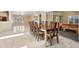 A beautifully lit dining room featuring a wooden table with seating for eight and sliding glass doors at 4405 Harbor Blvd, Port Charlotte, FL 33952