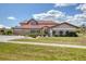 Two-story home with a tile roof, well-kept lawn, and manicured landscaping at 4405 Harbor Blvd, Port Charlotte, FL 33952