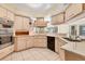 Updated kitchen features stainless oven, sleek black dishwasher and plentiful cabinetry at 4405 Harbor Blvd, Port Charlotte, FL 33952