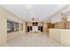 Spacious living room with tile floor, large window and built in shelves and cabinetry at 4405 Harbor Blvd, Port Charlotte, FL 33952