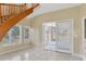 Bright living area with tile floors and glass doors leading to an outdoor space, connecting indoor and outdoor living at 4405 Harbor Blvd, Port Charlotte, FL 33952