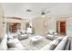 Staged living room with tile flooring, stylish furniture and decor at 4405 Harbor Blvd, Port Charlotte, FL 33952