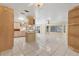 Large open living room area with tile floors and ceiling fans offers natural light at 4405 Harbor Blvd, Port Charlotte, FL 33952