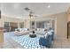 Staged living area features tile floor and large window with natural light at 4405 Harbor Blvd, Port Charlotte, FL 33952