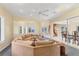 Open concept living area leading to dining and staircase with natural light at 4405 Harbor Blvd, Port Charlotte, FL 33952