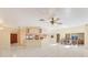 Spacious living room and kitchen area with white tile flooring and lots of natural light at 4405 Harbor Blvd, Port Charlotte, FL 33952