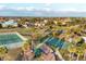 Community aerial showing the playground, tennis and basketball courts, and surrounding residential neighborhood at 4405 Harbor Blvd, Port Charlotte, FL 33952