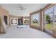 Enclosed sunroom with a hot tub, large windows, and access to the backyard, perfect for relaxation at 4405 Harbor Blvd, Port Charlotte, FL 33952