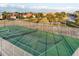 Aerial view of the community tennis court, showcasing its well-maintained green surface and surrounding fencing at 4405 Harbor Blvd, Port Charlotte, FL 33952