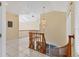 Upstairs hallway with a chandelier providing a view down to the first floor at 4405 Harbor Blvd, Port Charlotte, FL 33952